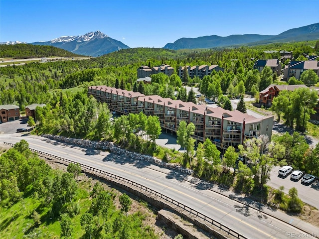 2449 Ryan Gulch Ct Unit 2449, Silverthorne, CO 80498 - drone / aerial view of a mountainous background and a heavily wooded area