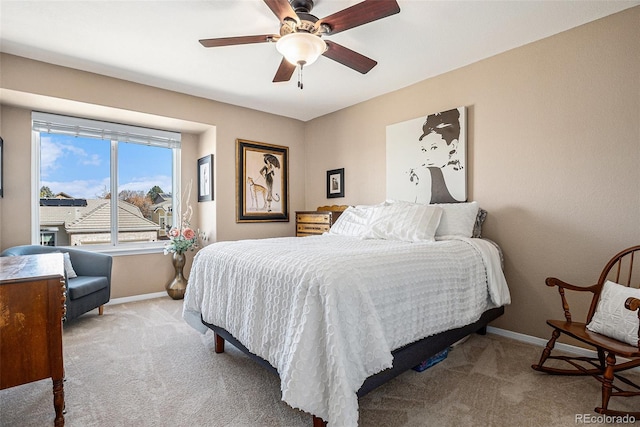 bedroom with carpet floors, ceiling fan, and baseboards