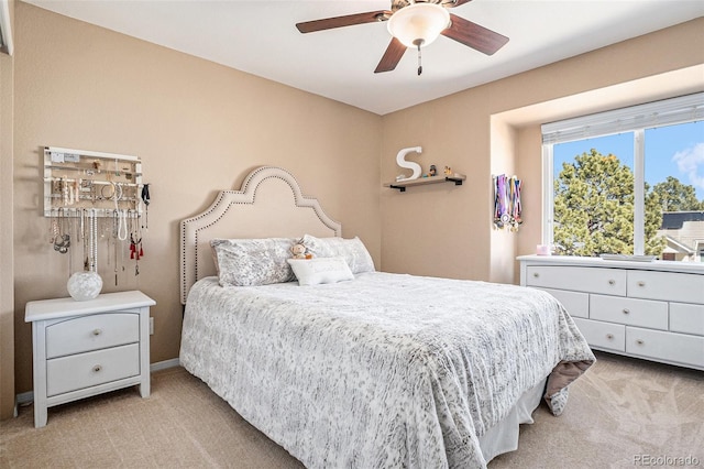 bedroom featuring ceiling fan and light colored carpet