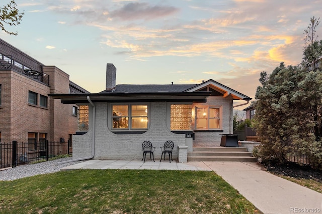 561 Cook St, Denver, CO 80206 - rear view of property featuring brick siding and a chimney