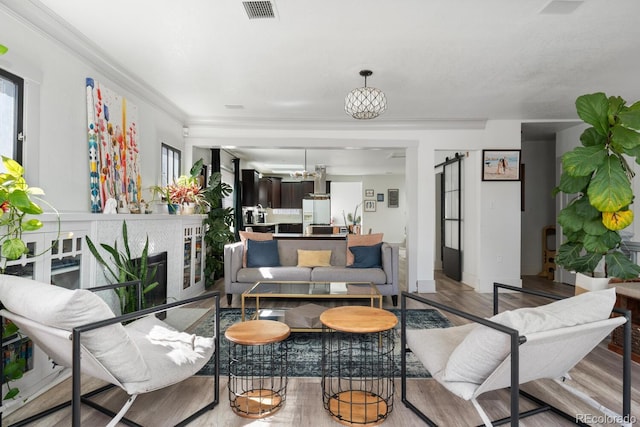561 Cook St, Denver, CO 80206 - living area featuring wood finished floors and ornamental molding