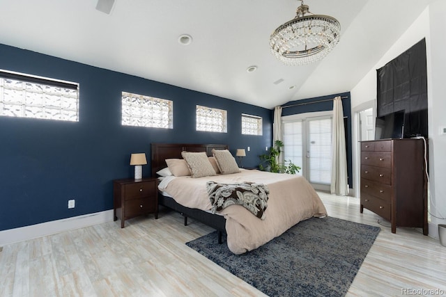 561 Cook St, Denver, CO 80206 - bedroom featuring a chandelier, wood finished floors, vaulted ceiling, and recessed lighting