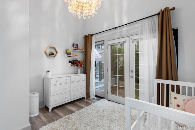 561 Cook St, Denver, CO 80206 - bedroom with wood finished floors, a chandelier, french doors, and access to outside