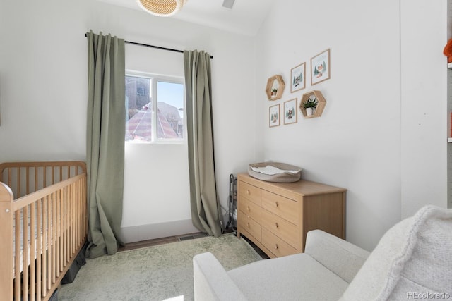 561 Cook St, Denver, CO 80206 - bedroom featuring a crib and a ceiling fan