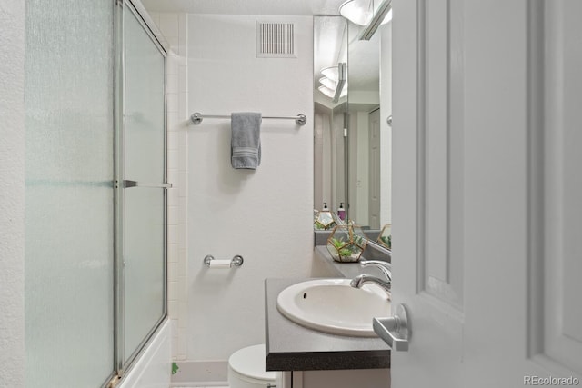 561 Cook St, Denver, CO 80206 - full bathroom featuring vanity, toilet, and shower / bath combination with glass door