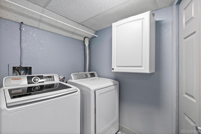 561 Cook St, Denver, CO 80206 - washroom with cabinet space and washing machine and dryer