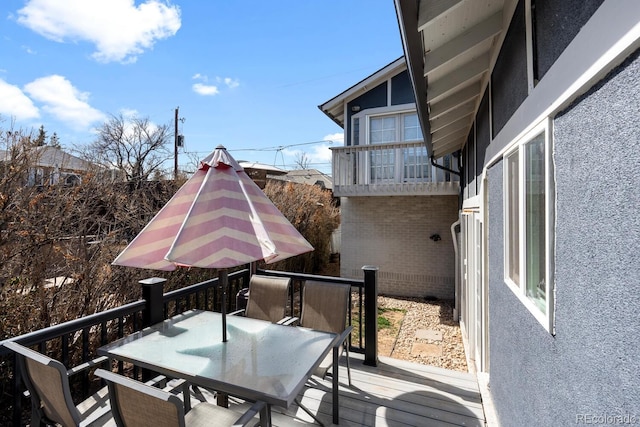 561 Cook St, Denver, CO 80206 - wooden deck with outdoor dining space