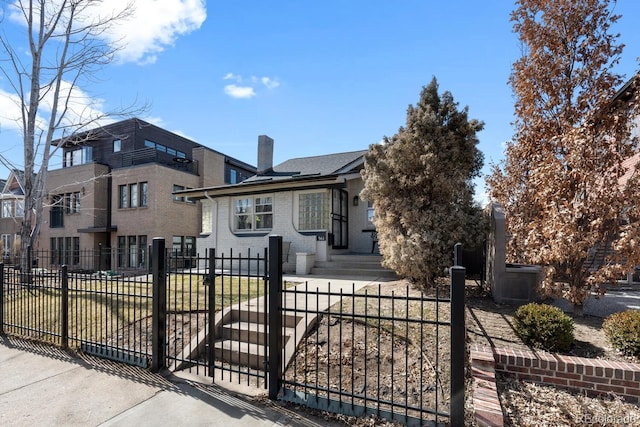 561 Cook St, Denver, CO 80206 - view of front facade featuring a chimney and brick siding