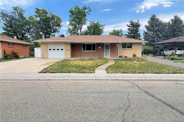 6236 Ingalls Ct, Arvada, CO 80003 - ranch-style home featuring concrete driveway, a front lawn, a garage, and brick siding