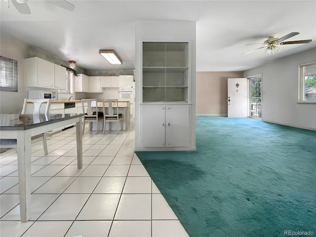 6236 Ingalls Ct, Arvada, CO 80003 - kitchen with a ceiling fan, white microwave, white cabinets, dishwasher, and light tile patterned floors