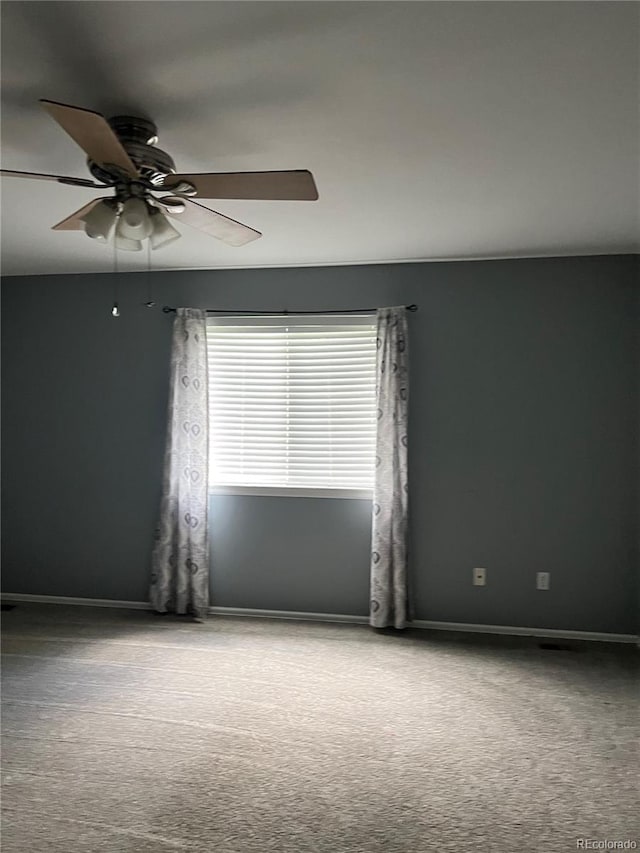 spare room with carpet flooring and ceiling fan