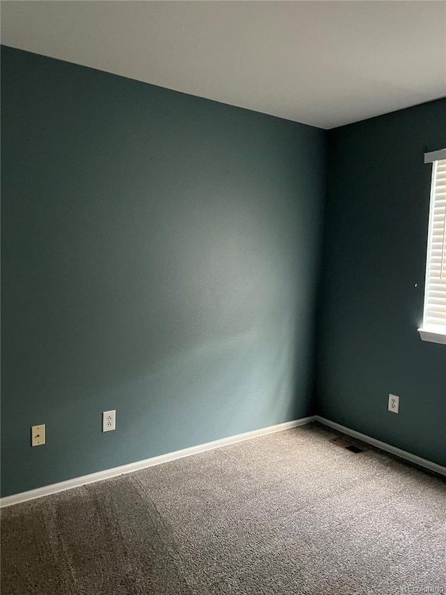 empty room featuring carpet flooring