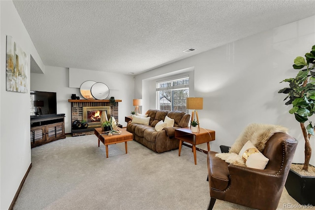 living room featuring carpet floors, a textured ceiling, visible vents, and a fireplace