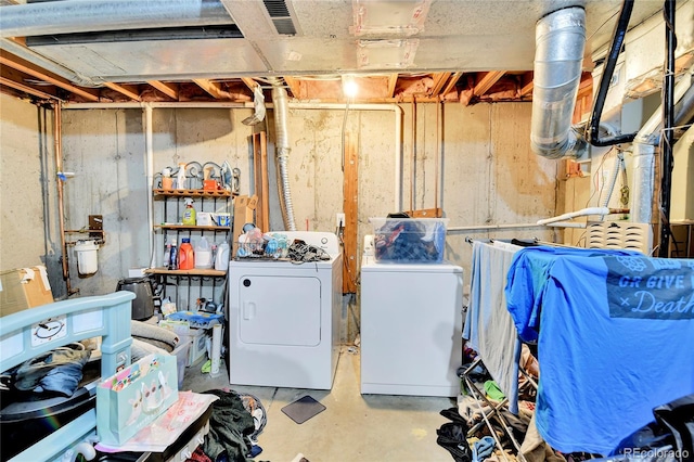 unfinished basement featuring washer and clothes dryer