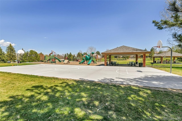 view of basketball court featuring a lawn, community basketball court, a gazebo, and playground community