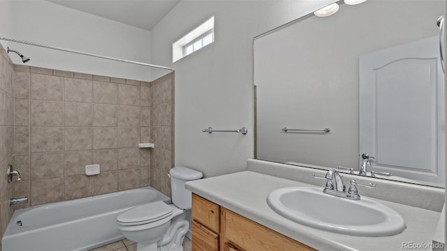 bathroom featuring toilet, shower / tub combination, tile patterned flooring, and vanity