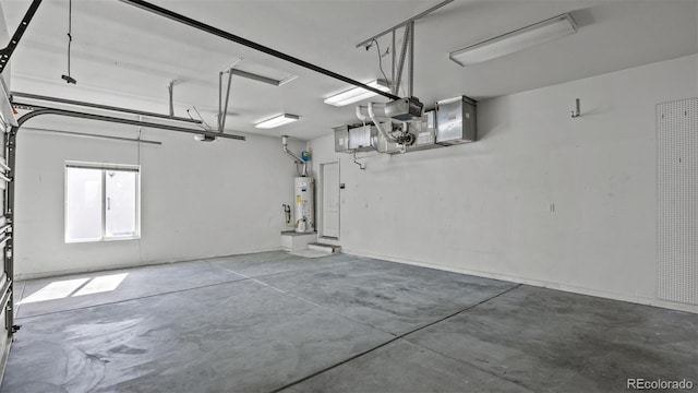 garage with a garage door opener and water heater