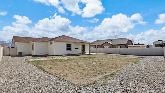 back of house featuring a patio area, a fenced backyard, and stucco siding