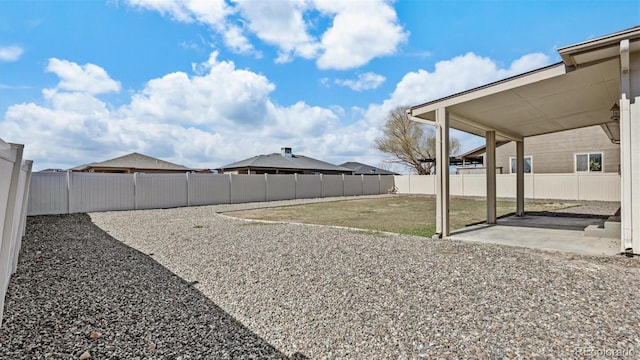 view of yard featuring a patio area and a fenced backyard