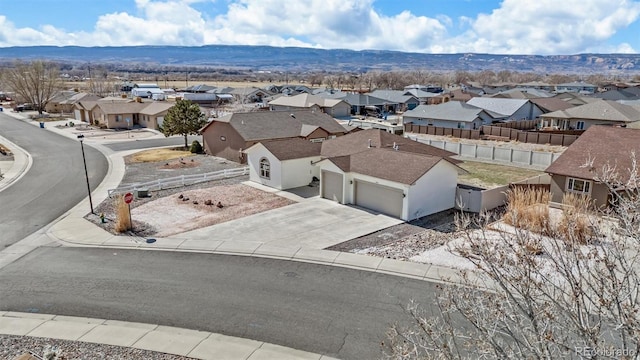 bird's eye view featuring a residential view and a mountain view