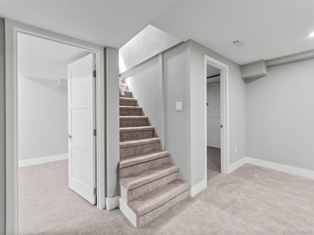 3630 Magnolia St, Denver, CO 80207 - staircase featuring carpet floors and baseboards