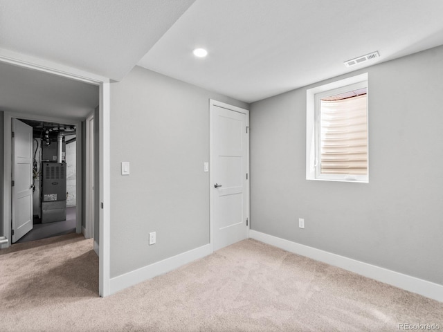3630 Magnolia St, Denver, CO 80207 - unfurnished bedroom featuring carpet, baseboards, heating unit, and recessed lighting