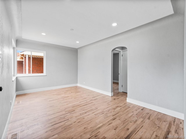 3630 Magnolia St, Denver, CO 80207 - unfurnished room featuring arched walkways, light wood-type flooring, recessed lighting, and baseboards