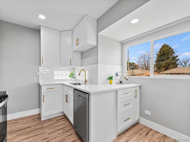 3630 Magnolia St, Denver, CO 80207 - kitchen with a sink, stainless steel dishwasher, white cabinetry, backsplash, and recessed lighting
