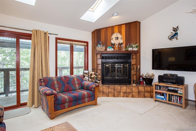 324 W Main St, Frisco, CO 80443 - living area featuring a skylight, carpet flooring, and a glass covered fireplace