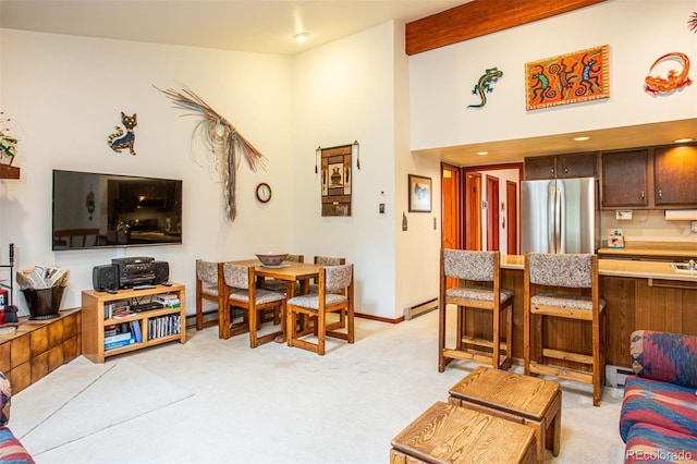 324 W Main St, Frisco, CO 80443 - living room featuring light colored carpet, high vaulted ceiling, baseboard heating, a baseboard radiator, and beam ceiling