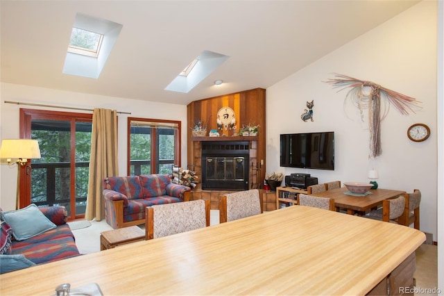 324 W Main St, Frisco, CO 80443 - dining room featuring a skylight, vaulted ceiling, and a glass covered fireplace