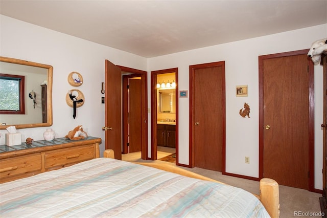 324 W Main St, Frisco, CO 80443 - bedroom with light carpet, ensuite bathroom, baseboards, and a sink