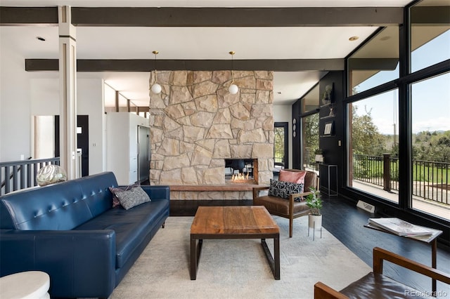 living room with wood finished floors and a fireplace
