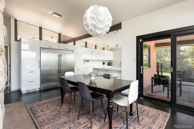 dining area featuring dark wood-style floors