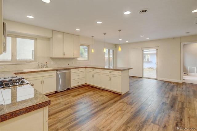 1275 Fairfax St, Denver, CO 80220 - kitchen featuring dishwasher, a peninsula, plenty of natural light, light wood-style floors, and recessed lighting