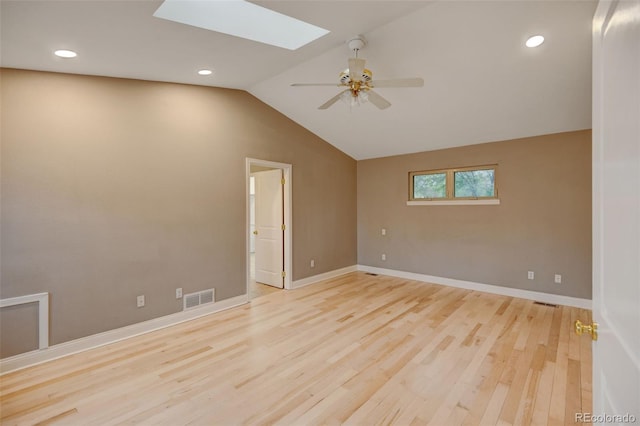 1275 Fairfax St, Denver, CO 80220 - empty room featuring wood finished floors, a skylight, lofted ceiling, a ceiling fan, and recessed lighting