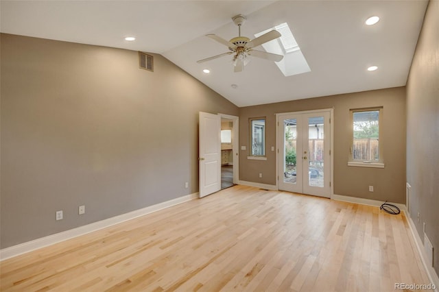 1275 Fairfax St, Denver, CO 80220 - spare room with a skylight, lofted ceiling, light wood finished floors, a ceiling fan, and recessed lighting