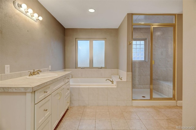 1275 Fairfax St, Denver, CO 80220 - bathroom with a garden tub, vanity, a shower stall, and tile patterned floors