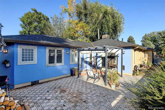 1275 Fairfax St, Denver, CO 80220 - rear view of property with a patio area, stucco siding, a pergola, and a shingled roof