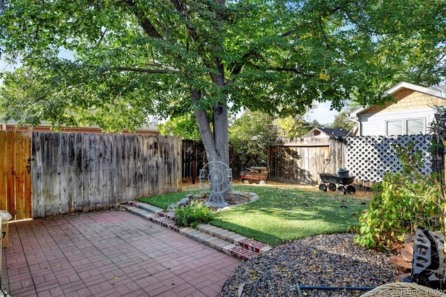 1275 Fairfax St, Denver, CO 80220 - fenced backyard with a patio area