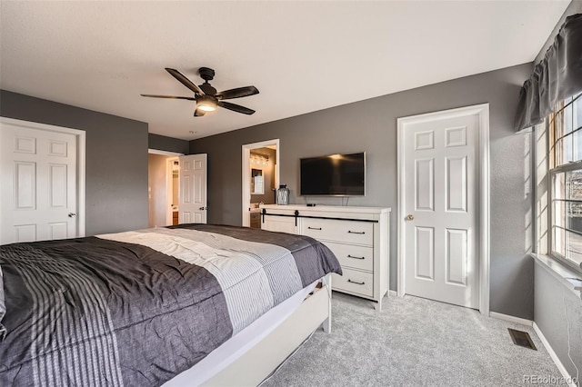 12362 Nate Cir, Parker, CO 80134 - bedroom featuring light carpet, baseboards, ceiling fan, and ensuite bath
