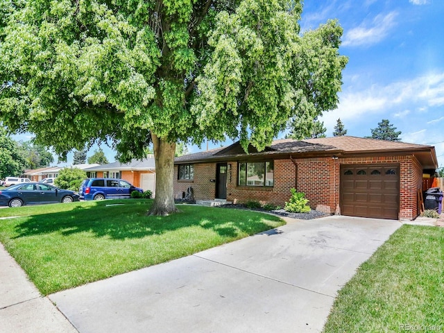 2046 S Quitman St, Denver, CO 80219 - ranch-style home featuring a garage, brick siding, a front lawn, driveway, and a shingled roof