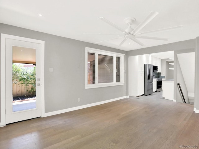2046 S Quitman St, Denver, CO 80219 - unfurnished living room featuring light wood-style flooring, a ceiling fan, and recessed lighting