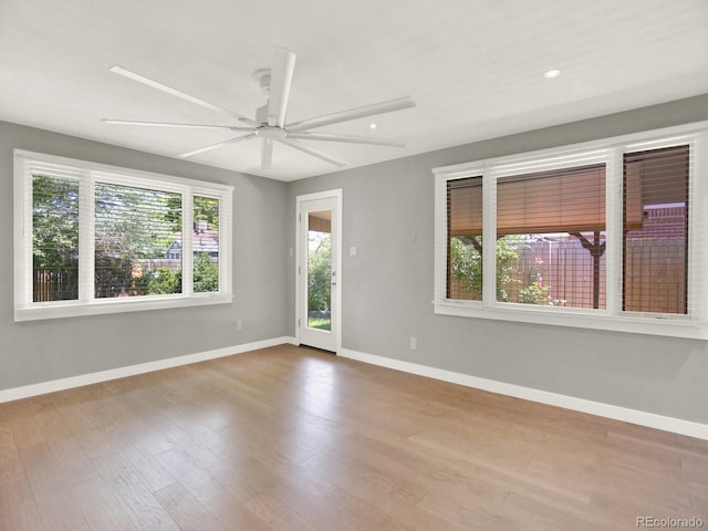 2046 S Quitman St, Denver, CO 80219 - spare room featuring wood finished floors, ceiling fan, and recessed lighting