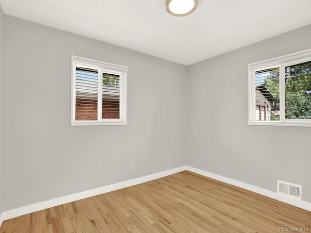 2046 S Quitman St, Denver, CO 80219 - empty room featuring baseboards and wood finished floors