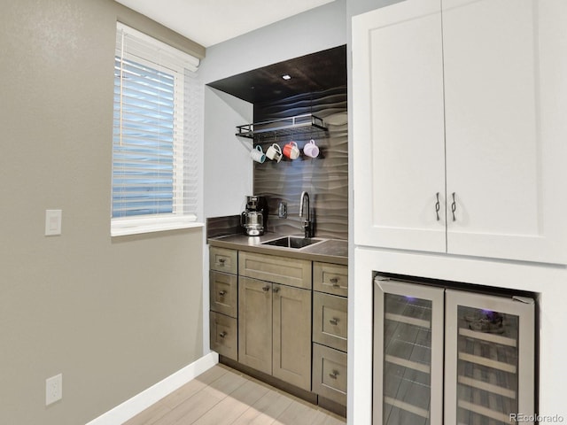2046 S Quitman St, Denver, CO 80219 - bar with beverage cooler and light wood finished floors