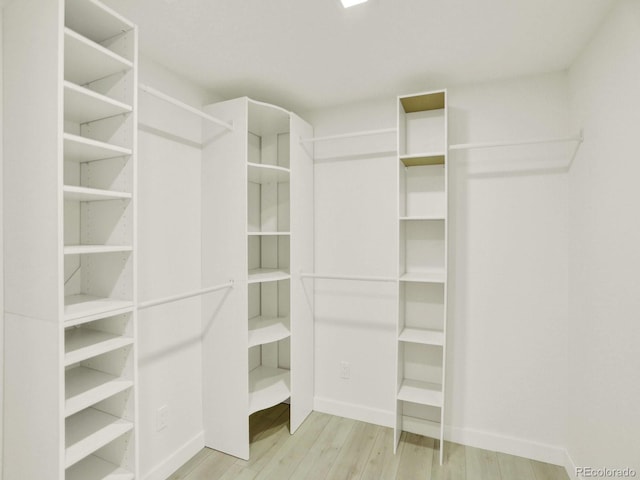 2046 S Quitman St, Denver, CO 80219 - walk in closet featuring wood finished floors