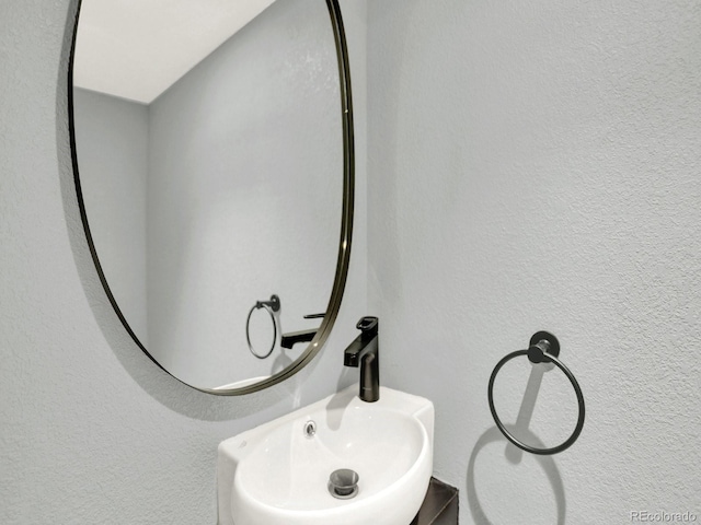 2046 S Quitman St, Denver, CO 80219 - bathroom view of a sink and a textured wall