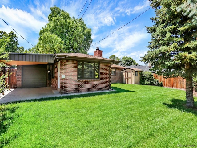 2046 S Quitman St, Denver, CO 80219 - rear view of house with brick siding, an attached garage, a shed, and a chimney