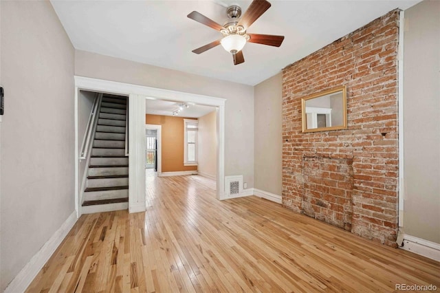 709 27th St, Denver, CO 80205 - unfurnished living room with light wood finished floors, stairway, baseboards, and a ceiling fan